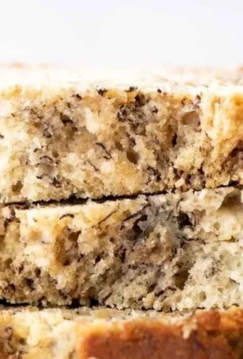 Delicious homemade banana bread sliced on a wooden board