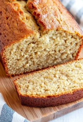 Freshly baked classic banana bread with sliced bananas on top