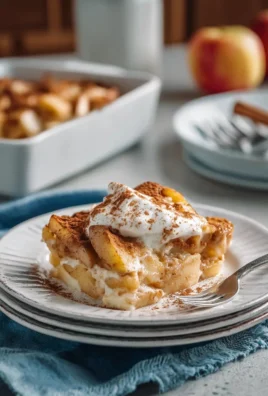 Apple Cinnamon Cottage Cheese Bake served in a dish with cinnamon sticks and apples