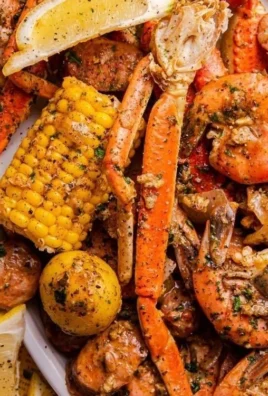 Delicious seafood boil with shrimp, crab, andouille sausage, and corn