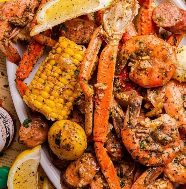 Delicious seafood boil with shrimp, crab, andouille sausage, and corn