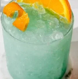 Blue Hawaiian Mocktail drink served in a vibrant glass with tropical garnishes.