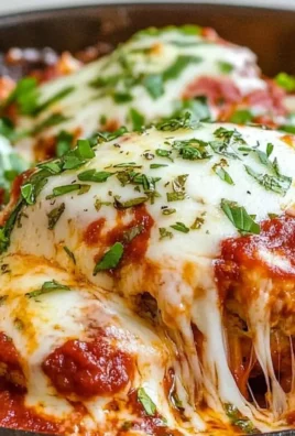 Delicious Chicken Parmesan served with pasta and tomato sauce