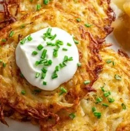 Crispy authentic German potato pancakes served with applesauce and sour cream