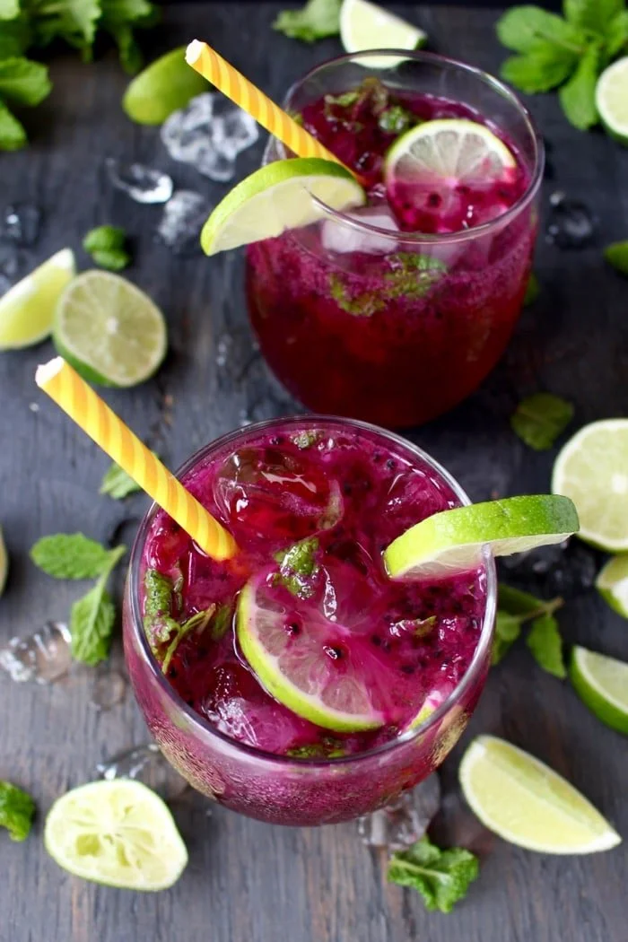 Refreshing Dragon Fruit Juice Mojito served in a glass with mint leaves.