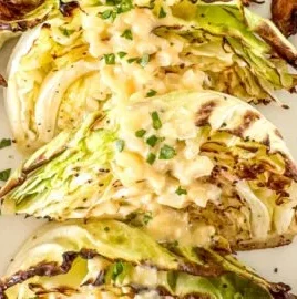 Easy roasted cabbage with onion Dijon sauce on a plate