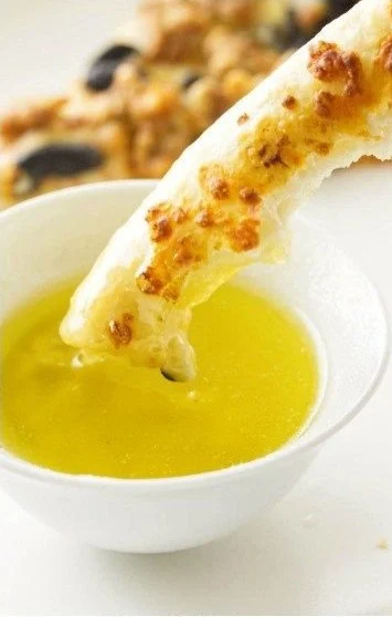 Delicious garlic butter sauce drizzled over cooked pasta and seafood.