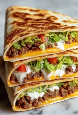 Delicious Keto Beef Crunchwraps served on a plate, featuring fresh ingredients.