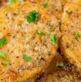 Crispy Parmesan crusted potatoes served on a plate
