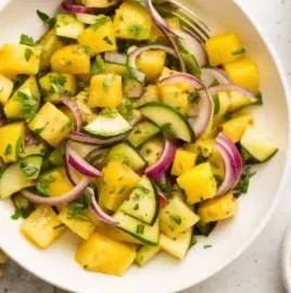 A vibrant Pineapple Cucumber Salad with fresh ingredients and colorful presentation.