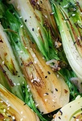 Quick and easy sautéed baby bok choy served in a vibrant dish