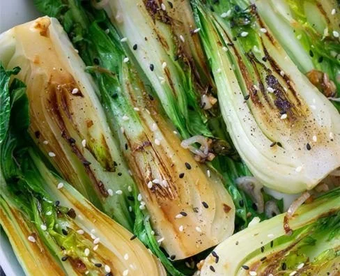 Quick and easy sautéed baby bok choy served in a vibrant dish