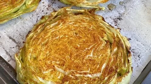 Delicious roasted cabbage steaks served on a plate
