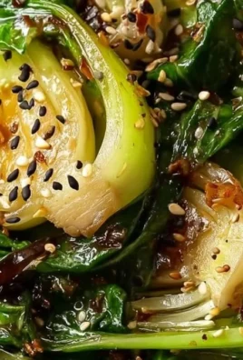 Sautéed bok choy served in a bowl with garlic and ginger seasoning
