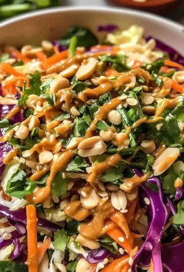 Thai Crunch Salad with peanut ginger sauce in a bowl