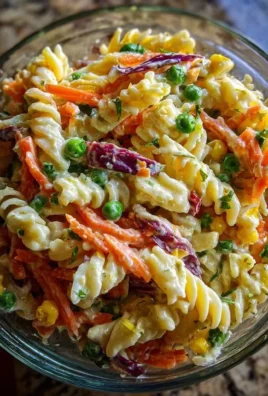 Delicious crack pasta salad in a bowl garnished with herbs
