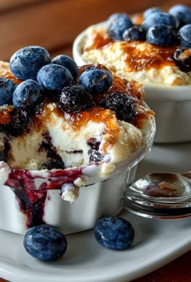 Baked blueberry cottage cheese bowls topped with fresh blueberries and almonds