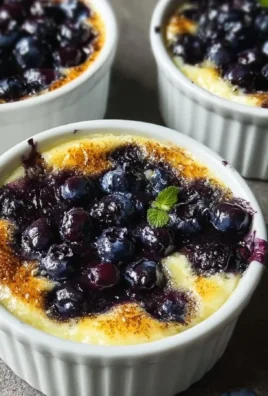 Baked blueberry cottage cheese breakfast dish topped with fresh blueberries