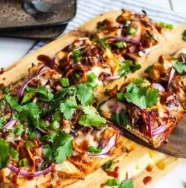BBQ Chicken Flatbread Pizza with cheese and fresh toppings