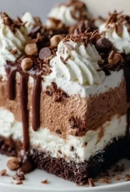 Delicious Brownie Refrigerator Cake topped with chocolate and whipped cream