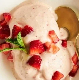 Delicious homemade cottage cheese ice cream in a bowl with fresh fruits