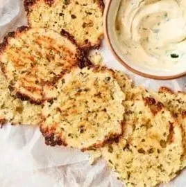 Crispy cottage cheese chips served in a bowl, a healthy snack option.