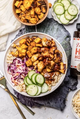 Healthy hot honey chicken bowls with fresh vegetables and rice