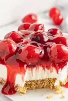 Easy Cherry Delight dessert with fresh cherries and cheesecake layers