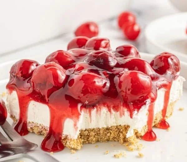 Easy Cherry Delight dessert with fresh cherries and cheesecake layers