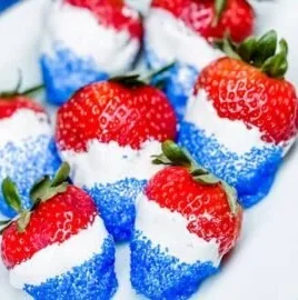 Easy dessert of strawberries, blueberries, and whipped cream for festive occasions