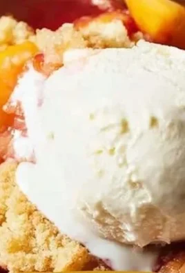 Homemade easy peach cobbler served with vanilla ice cream