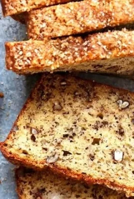 Slice of Greek Yogurt Banana Bread topped with banana slices