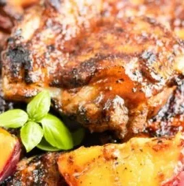 Grilled Bourbon Peach BBQ Chicken with juicy peaches and barbecue sauce.
