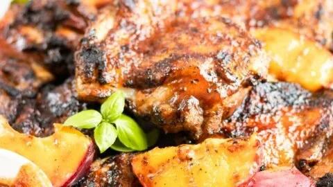 Grilled Bourbon Peach BBQ Chicken with juicy peaches and barbecue sauce.