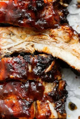 Delicious grilled ribs served with barbecue sauce and sides