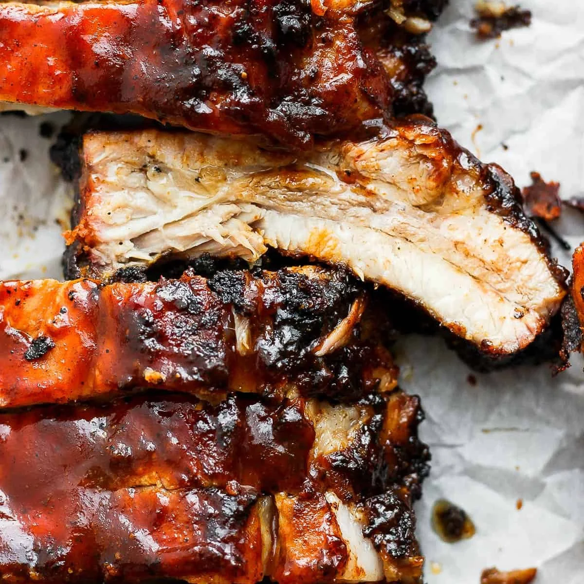Delicious grilled ribs served with barbecue sauce and sides