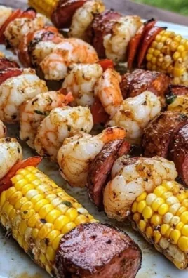 Delicious grilled seafood skewers with shrimp and vegetables on the grill