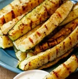 Delicious grilled zucchini slices served on a plate.