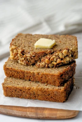 Healthy banana bread loaf with ingredients like ripe bananas and nuts