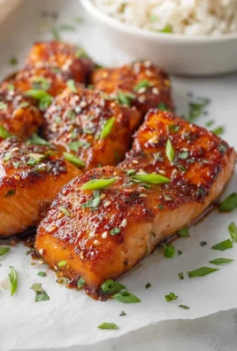 Honey Garlic Salmon Bites served on a plate with garnish