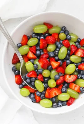 Colorful honey lime fruit salad with a mix of fresh fruits and vibrant dressing