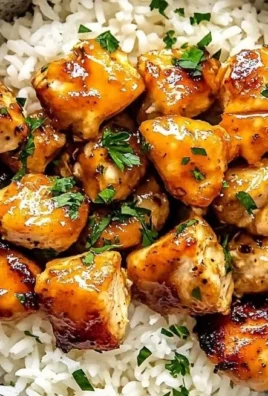 Delicious Hot Honey Chicken Bowls topped with spicy honey sauce and fresh garnishes