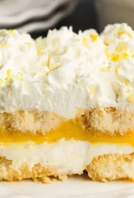 Delicious lemon tiramisu dessert garnished with lemon zest and mint leaves
