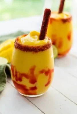Delicious Mexican Mangonada topped with chamoy and Tajín seasoning