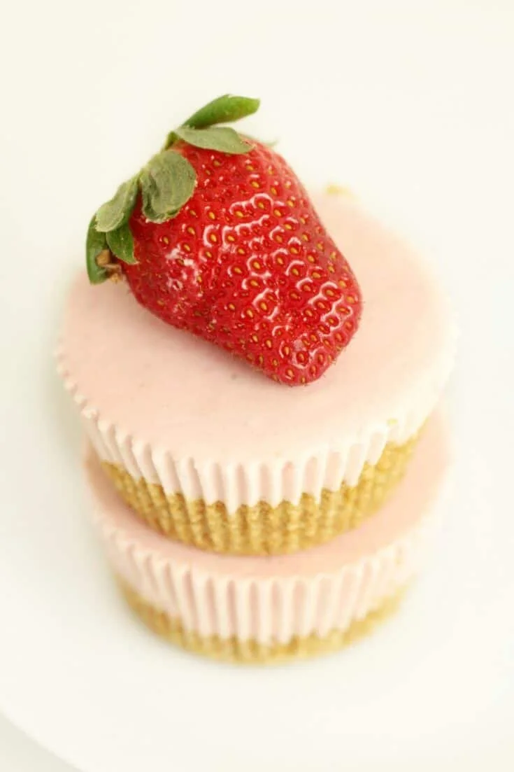 Mini no-bake strawberry cheesecakes with fresh strawberries on top