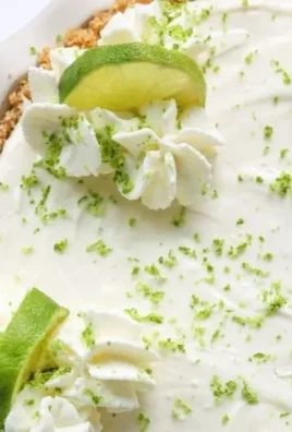 No Bake Key Lime Pie with a graham cracker crust and lime garnish