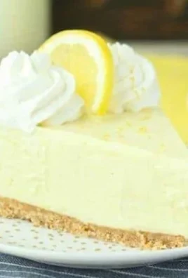 No-bake lemon cream pie topped with fresh whipped cream and lemon zest