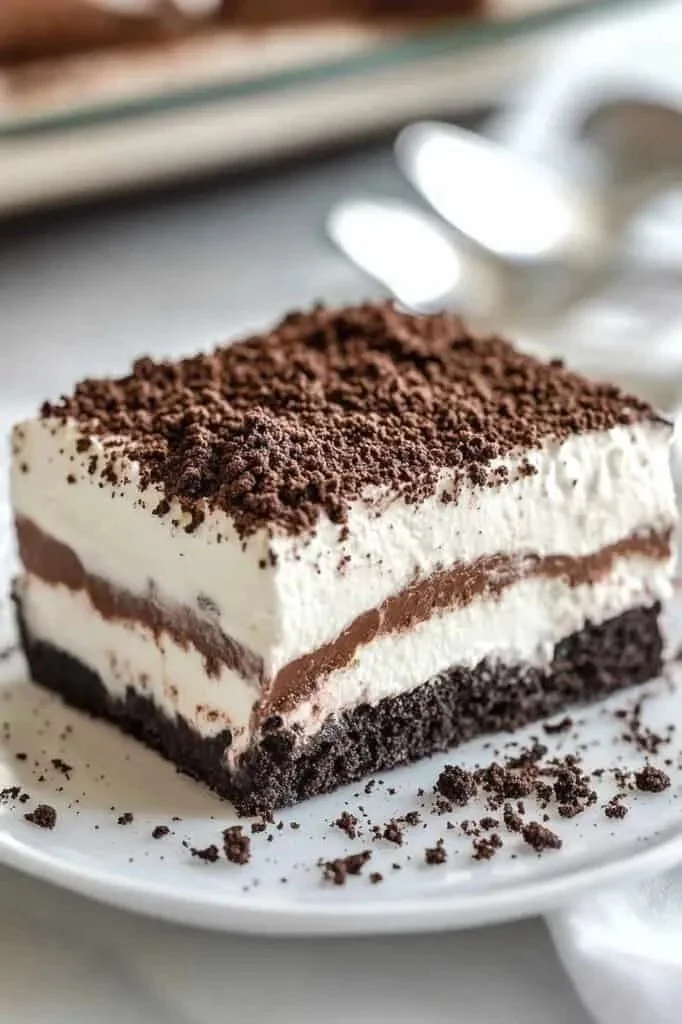 Delicious no bake Oreo lasagna dessert with creamy layers and crushed cookies
