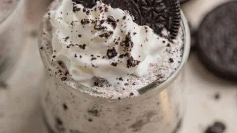 Delicious Oreo no-bake cheesecake cups topped with crushed Oreos