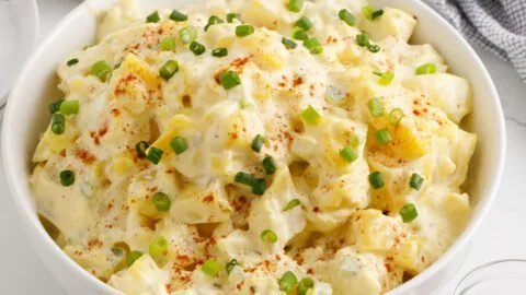 Delicious homemade potato salad with fresh herbs and vegetables